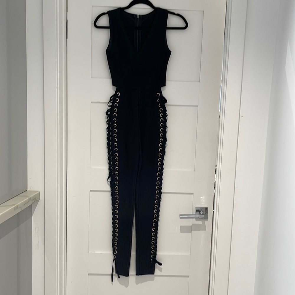 Black & gold bandage lace up pant jumpsuit. Zipper back. Size S